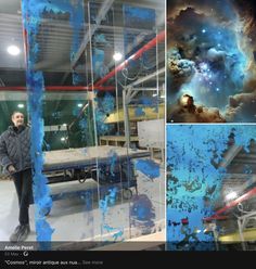 a man standing in front of a window with blue paint on it and an image of the sky