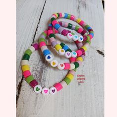 Fun colorful bracelets made with resin beads and stretchable cord.   Bracelets are designed for little girls age 5 to 9 years old.  Bracelets are 5.5 inch round stretch Playful Heart-shaped Letter Beads Bracelet, Valentine's Day Multicolor Letter Beads Stretch Bracelet, Handmade Playful Heart Beaded Bracelets, Handmade Heart-shaped Playful Bracelets, Handmade Playful Heart-shaped Bracelets, Playful Handmade Heart Bracelets, Handmade Heart-shaped Playful Bracelet, Playful Handmade Heart-shaped Bracelet, Playful Adjustable Bracelets With Heart Beads