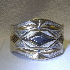 Up For Sale Is A Montana Silversmiths Gold Silver Aztec Southwestern Cuff Bracelet Mint Condition Mint Condition. Silver Gold Aztec Western Southwestern Brand Montana Silversmiths Type Bracelet Color Silver Gold Style Bangle, Cuff Theme Western, Cowboy, Rodeo, Aztec Base Metal Silver Plated Metal Silver Plated Country Of Origin United States Please Look At All The Pictures And Consider Them Part Of The Description, They Are The Actual Item For Sale. Please Email Me With Any Questions That You Might Have. 0151580#1#Mer#Posh Montana Silversmith Jewelry, Cowboy Rodeo, Indigenous Americans, Western Cowboy, Gold Style, Base Metal, Womens Jewelry Bracelets, Rodeo, Cuff Bracelet