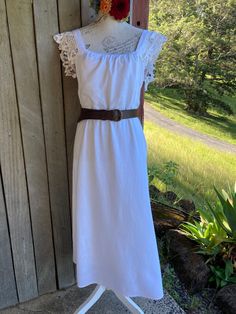 "white dress linen / viscose blend featuring cotton lace on the shoulders and upper back with long slender ties at the low back lined ** note that this is a modified quality preloved garment  SIZE   ~  small / medium  armpit to armpits across the front is 53 cm / 21\"  92 cm / 36\" around the high waist ( the seam below the bust) length is  119 cm / 47\" mannequin is size small the leather belt isn't included in the sale, but the matching white sash is." Fitted White Linen Bohemian Dress, Fitted White Linen Dress Bohemian Style, Fitted White Bohemian Linen Dress, White Fitted Bohemian Linen Dress, Bohemian Midi Dress With Lace Trim For Brunch, Bohemian White Midi Dress With Lace Trim, White Midi Dress With Lace Sleeves For Summer, Dress Linen, Lace Tunic