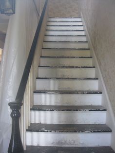 an old set of stairs with white paint