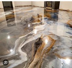 the floor is covered in marble and has different colors