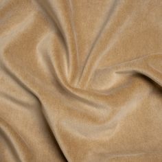 a close up view of a tan colored fabric