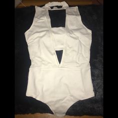 Super Sexy White Bodysuit From Fashion Nova! Never Worn, Tags Are Still On This. Was A Bit Too Tight For Me. White Bodysuit For Club And Summer, White Sleeveless Bodysuit For Night Out, Halter Neck Bodysuit For Club With Lined Body, Backless Cutout Bodysuit For Night Out, Elegant Cutout Bodysuit For Party, Chic Bodysuit For Date Night, Fitted Bodysuit For Going Out In Summer, Cutout Halter Neck Bodysuit For Party, One-piece Lined Bodysuit For Night Out