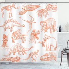 an orange shower curtain with dinosaurs and other animals on it in a white bath room