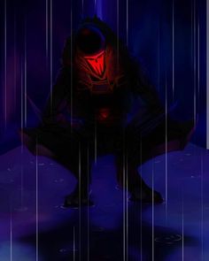 a man kneeling down in the rain with an umbrella over his head and red light shining on him