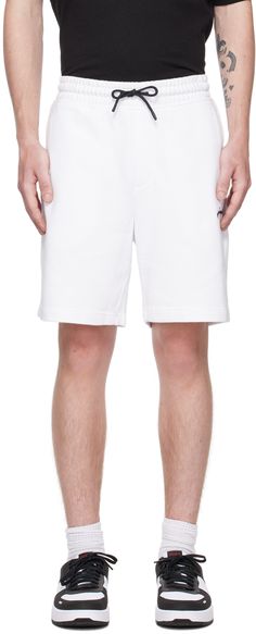 French terry shorts. · Drawstring at elasticized waistband · Three-pocket styling · Mock-fly · Logo embroidered at front Supplier color: White White Casual Athletic Shorts With Side Pockets, White Athletic Shorts With Side Pockets, Casual White Athletic Shorts With Side Pockets, White Bermuda Bottoms For Loungewear, White Cotton Athletic Shorts With Drawstring, Fly Logo, Outfit Uomo, French Terry Shorts, Terry Shorts