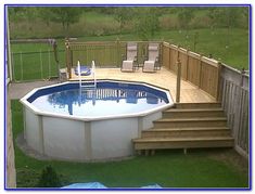 an above ground pool with steps leading up to the deck area and chairs around it