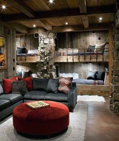 a living room filled with lots of furniture next to a fire place and bookshelf