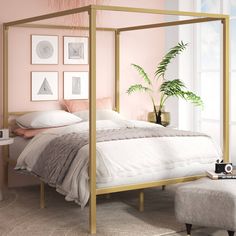 a bedroom with pink walls and white bedding has a gold metal frame over the headboard