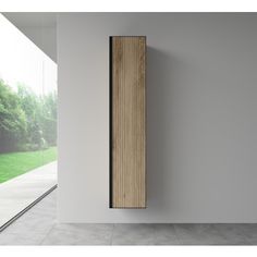 a tall wooden radiator mounted to the side of a wall