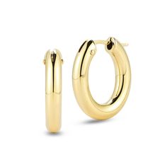 These Roberto Coin earrings from the Perfect Gold Hoops Collection are the ideal everyday style. Crafted in 18k yellow gold, these oval hoops boast a classic design and have hinged snap post closures. These earrings measure 17mm in length. Roberto Coin signs each one of his pieces with a small ruby casted inside the piece, in direct contact with the skin of the one who wears it. This magical signature, surrounded by an antique halo of legend, represents the message of good wishes that Roberto Co Timeless Polished Finish Huggie Earrings For Formal Occasions, Timeless Polished Huggie Earrings For Formal Occasions, Elegant Oval Huggie Earrings For Everyday, Luxury Oval Huggie Earrings Gift, Classic Oval Earrings For Everyday, Luxury Oval Huggie Earrings For Formal Occasions, Timeless Yellow Gold Hoop Earrings For Formal Occasions, Classic Polished Huggie Earrings For Formal Occasions, Formal Classic Huggie Earrings With Polished Finish