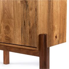 a close up of a wooden cabinet with wood legs