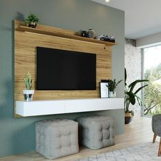 a living room with a large flat screen tv on the wall