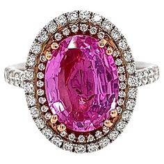 4.56 Total Carat Oval Pink Sapphire and Diamond Double Halo Pave-Set Ladies Ring. GIA Certified. -Metal Type: Platinum, 18K Rose Gold -3.61 Carat Oval Cut Natural Sapphire, GIA Certified -Sapphire Color: Pink -Sapphire Measurements: 11.37 x 8.63 x 4.15 mm -0.95 Carat Side Round Natural side Diamonds. E-F Color, VS Clarity -Size 6.0 Made in New York City. Jewelry Words, Ladies Ring, Sapphire Color, Double Halo, Natural Sapphire, Sapphire Diamond, Pink Sapphire, Jewelry Designs, Cocktail Rings