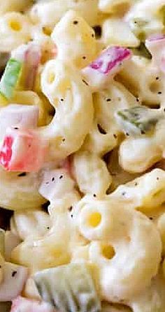 a close up view of macaroni and cheese with colorful candies on it