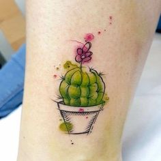 a small cactus tattoo on the ankle