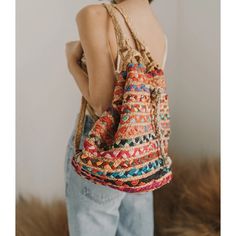 Unique, eco-friendly backpack handcrafted in Rajasthan with vibrant, upcycled Indian textiles and sustainable jute fibers. This versatile bag features two sturdy, braided jute back straps and braided jute drawstring closure cord, providing convenience and style to your day at school, the market, the park, the beach and beyond! Chindi weaving is a traditional and cultural art form which gives function and new purpose to upcycled materials. Made fair trade, by hand in India Casual Beach Woven Backpack, Casual Woven Backpack For Beach, Casual Beach Backpack With Woven Details, Casual Woven Backpack For The Beach, Bohemian Natural Color Backpack, Summer Woven Backpack, Bohemian Woven Backpack For Daily Use, Summer Woven Backpack For Daily Use, Woven Backpack For Daily Use In Summer