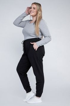 Our Plus-Size Jogger Pants provide a stylish and comfortable fit. Featuring an adjustable waistband and a relaxed silhouette, these joggers are designed to flatter. Plus, their functional side pockets make them practical for everyday wear. Experience a perfect blend of fashion and relaxation with these stylish joggers. Plus-Size Jogger Pants Details: Model is wearing a 1XModel SpecsHeight: 5'8"Bust: 40G Waist: 38.5"Hips: 49" Style: Casual Print / Pattern: Plain Silhouette: Jogger Fit: Relaxed Em Casual Full-length Joggers With Comfort Waistband, Joggers Plus Size, Relaxed Fit Full-length Joggers With Side Pockets, Black Full-length Joggers With Pockets, Plus Size Joggers, Black 4-way Stretch Joggers With Pockets, Pants Details, Adjustable Waistband, Plus Size Jumpsuit