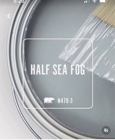 a paint can with a brush in it and the words half sea fog on it