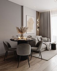 a living room filled with furniture and a dining table next to a large glass window