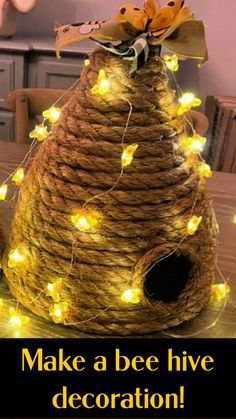 a beehive made out of rope with lights on it's head and the words make a bee hive decoration