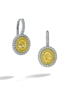 A pair of platinum and 18K yellow gold earrings that have a mixture of yellow and white diamonds.There are 2 oval yellow diamonds that weigh 1.07 carats while the yellow diamonds surrounding it are 0.16 CTw.The white diamonds that cover the rest of the earring are 0.37 CTW. Oval Diamond Earring, Yellow Diamond Earrings, Goth Wardrobe, Yellow Diamond Earring, Yellow Diamonds, Fancy Yellow Diamond, Yellow Gold Earrings, Diamond Earring, Luxury Women Fashion