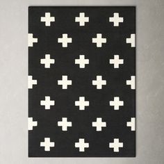 a black and white rug with crosses on it