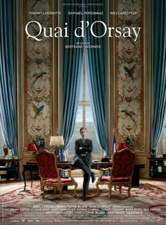 a movie poster for the film quani d'orsay with a man sitting at a table