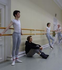 a group of young men and women in ballet outfits