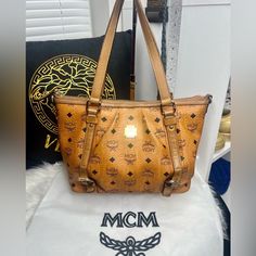 Gorgeous Preloved Mcm Luxury Handbag! Codey5722 Good Exterior Condition. Good Interior Condition. Only One Spot Damaged And Looks Like Someone Tried Repairing It On Corner Bottom. Can’t Hardly See It. I Did Zoom In On Bag So You Can See It And Next Picture After Is What It Looks Like From Distance. Not Very Visible At All. Zipper Works Great. No Repairs To It. The Bag Has Been Conditioned And Protectant Added By Myself, Gold Is Slightly Tarnish But Has Been Cleaned And Shined As Best To Ability. Very Nice. Purse Is In Great Shape. Beautiful. The Only Other Damage I See Is The Long Shoulder Strap. (Which Is Removable So You Don’t Even Have To Use And Can Buy Mcm Handbags, Like Someone, Liking Someone, Luxury Handbags, See It, Shoulder Strap, Womens Sizes, Bag Lady, Purse