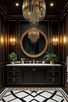 an elegant bathroom with black walls and gold trimming, chandelier above the sink