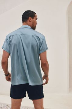 If you're a guy that likes details and neutral tones, then the Vaughn Blue Satin Camp Shirt is perfect for you! Wear it to a festival, on tropical vacation with the boys, or for your casual everyday look. PRODUCT DESCRIPTION AND MATERIALS: - blue satin short sleeve men's top - button up front closure - finished hem - 95% polyester, 5% spandex - dry clean SIZE RECOMMENDATIONS: - runs true to size Small - length: 29" - chest: 22" across - sleeve length: 6.5" Medium - length: 29.5" - chest: 23.25" Satin Short Sleeve, Satin Short, Camp Shirt, Tropical Vacation, Blue Satin, Camping Shirt, Casual Everyday, Neutral Tones, The Boys