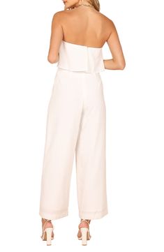 A drapey bodice and wide legs enhance the flowy silhouette of this effortless strapless jumpsuit destined for a memorable occasion. Hidden back-zip closure Strapless Lined 79% polyester, 20% cotton, 1% spandex Hand wash, dry flat Imported Spring Strapless Jumpsuit For Evening, Strapless Jumpsuit For Spring Evening, Strapless Jumpsuit For Date Night In Summer, Bandeau Strapless Jumpsuit For Spring Evening, Spring Evening Bandeau Strapless Jumpsuit, Spring Evening Strapless Bandeau Jumpsuit, Chic Bandeau Jumpsuits And Rompers For Spring, Chic Strapless Jumpsuits And Rompers, Spring Evening Strapless Wide Leg Jumpsuit