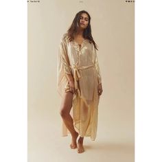 Free People Shilow Kaftan In Gold Small. Style No. 68921360; Color Code: 070 Sparkle And Shine With This Glimmering Kaftan By Sundress, Featured In A Relaxed, Pull-Over Silhouette With Flared Bell Sleeves, Belted Waistband, And Sheer Metallic Fabrication For A Head-Turning Finish. Pull-Over Style Bell Sleeves Maxi Length Robe Tie Detail What’s Care Fp? This Product Was Consciously Made To Reduce Our Footprint And Supports Our Mission To Be A Little Bit Better Every Day. Specifically, This Produc Chic Gold Maxi Dress For Beach, Gold Maxi Dress For Summer Beach, Long Gold Maxi Dress For Summer, Gold Kaftan For Summer Vacation, Gold Maxi Beach Dress, Gold Maxi Dress For The Beach, Gold Maxi Length Dress For Beach, Gold Bohemian Kaftan For The Beach, Gold Bohemian Maxi Dress For The Beach