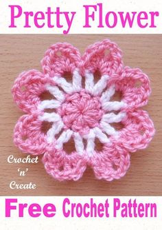 a crochet flower is shown with the words pretty flower written in white and pink