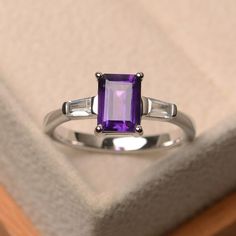 image 0 Purple Stone Rings, Emerald Cut Rings, Emerald Engagement Ring Cut, Three Stone Ring, Engagement Ring Cuts, Purple Stones, February Birth Stone, Three Stone Rings, Amethyst Gemstone