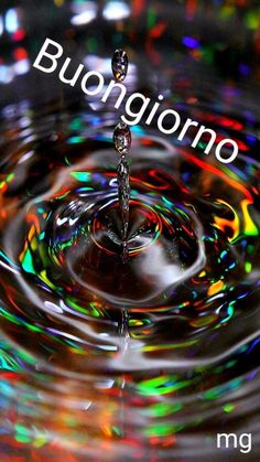 a water drop with the word buongioro on it in front of colorful lights