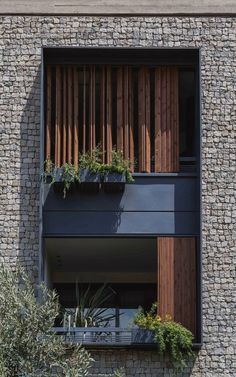 an apartment building with wooden slats on the windows