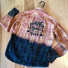 a pink and blue plaid shirt with the words jumpin'dance nice on it