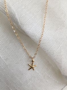 "♡ 14K gold-filled 18\" chain with 4/8\" hallow starfish charm- all components used on this necklace is 14k gold filled, sourced from USA. ♡ If your purchase is a gift, let me know and I'd be happy to include a lovely gift card for no additional charge. All items are packaged in jewelry boxes. ♡ Most of my jewelry can be ordered in multiples. Please contact me if you are interested in purchasing two or more of one item and I can set up a special listing for you. ♡ All orders ship to the address Dainty Starfish Charm Jewelry For Gift, Gold Jewelry With Starfish Charm For Gift, Gold Jewelry With Starfish Charm As A Gift, 14k Gold Filled Star Charm Necklace As A Gift, Dainty Starfish Charm Jewelry Gift, 14k Gold-filled Star Charm Necklace As Gift, Gold Starfish Shaped Dainty Jewelry, Dainty Gold Starfish Jewelry, Dainty Starfish Gold Jewelry