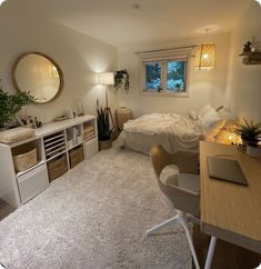 a bedroom with a bed, desk and shelves