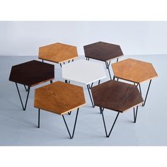 six tables with different colors and designs on them, all stacked up in the same direction