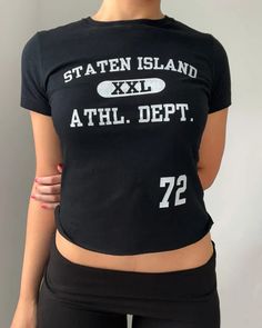 Staten Island Athl. Dept. baby tee (full length) – Bit By Angie Casual Cropped T-shirt With Text Print, Black Y2k Cropped T-shirt For Spring, Sporty Stretch Cropped T-shirt With Graphic Print, Black Cropped T-shirt With Logo Print, Black Cotton Sporty Cropped T-shirt, Sporty Letter Print Crop Top T-shirt, Black Slogan Crop Top T-shirt, Trendy Black Cropped T-shirt With Slogan, Black Slogan Cropped T-shirt For Streetwear