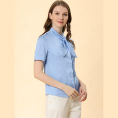 This shirt looks applicable to everyday work clothes in addition to dress-up. The silky fabric shapes this shirt with a tie-neck collared neckline and short sleeves. The curved hem gives it a neat finish over pants. The tie-neck adds casual-inspired sophistication, while soft fabric gives it an elegant, feminine shape. This elegant satin shirt features a tie-bow neck and short sleeves, making it a versatile addition to your wardrobe. Suitable for various occasions including work, office, formal Tie Neck Shirt, Elegant Feminine, Silky Fabric, Women's Blouses, Tie Bow, Satin Shirt, Work Tops, Hem Style, Polka Dot Blouse