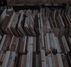 many books are stacked on top of each other