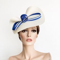 This off white fascinator with  royal blue bow in two colors, is attached on a thin satin  headband in the color you want. (black, brown or blonde)This fascinate hat is perfect for the Kentucky derby, Ascot races, weddings,  Belmont or Preak Hat or  any special occasion like .If you can custom the colours, the side to wear it or have any special questions please, contact me.* PROCESSING TIME: 5-7 business days.* DELIVERY TIME (DHL EXPRESS WITH TRACKING NUMBER): 1-4 business days to all countries Fascinator Hats Outfit, Royal Blue Fascinator, Bow Fascinator, Wedding Hats For Guests, Cup Hat, Fascinator Hats Diy, Fascinator Hats Wedding, White Fascinator, Kentucky Derby Fascinator