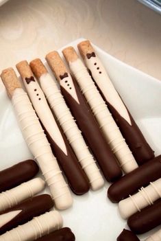 there are many chocolate sticks that have been made to look like toothpicks with bow ties on them