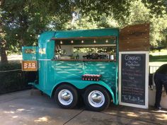 a food truck is parked on the side of the road