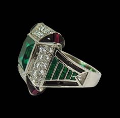 Art Deco Green Emerald Multi-stone Ring, Luxury Green Octagon Rings, Luxury Multi-stone Emerald Cut Emerald Ring, Luxury Rectangular Emerald Ring In White Gold, Luxury Emerald Ring In Rectangular Shape, Luxury Emerald Ring With Rectangular Shape, Luxury Emerald Rectangular Ring, Luxury Silver Emerald Rectangular Ring, Luxury Silver Rectangular Emerald Ring